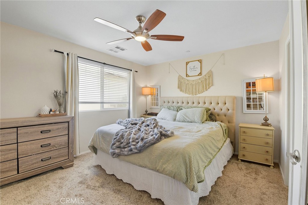 21711 Doss Place Saugus, CA 91350 - Photo 12 of 27 a bedroom with a bed and a window