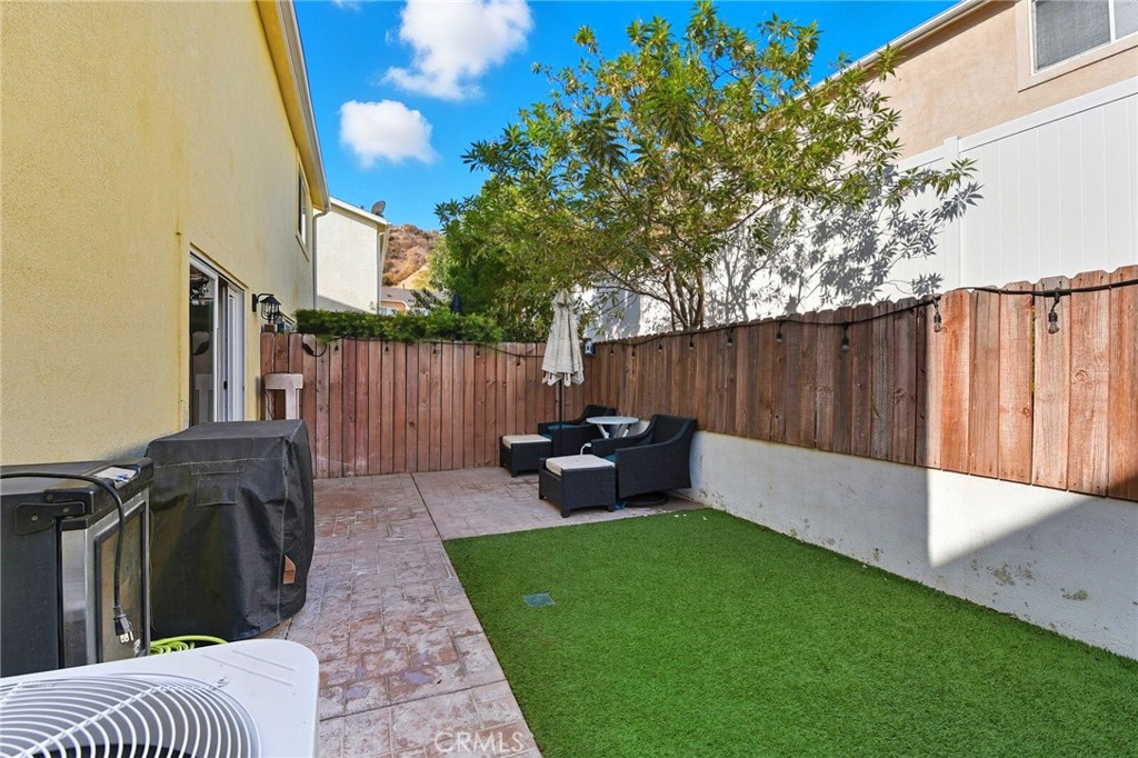 21711 Doss Place Saugus, CA 91350 - Photo 19 of 27 a view of a backyard with furniture