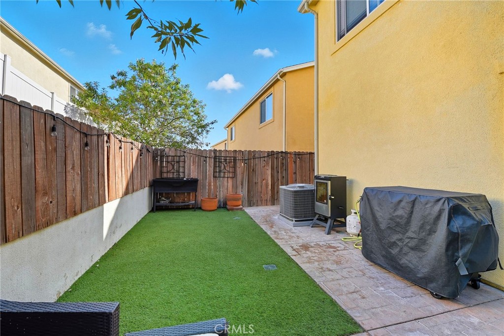 21711 Doss Place Saugus, CA 91350 - Photo 20 of 27 a view of a back yard with a wooden fence