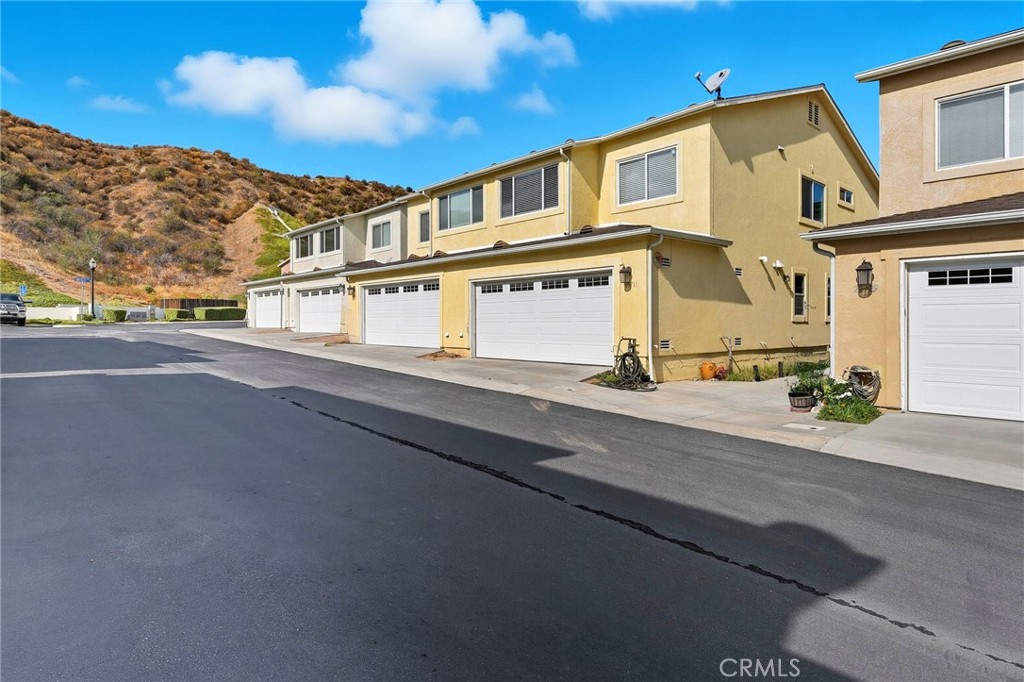 21711 Doss Place Saugus, CA 91350 - Photo 21 of 27 a view of a building with a street