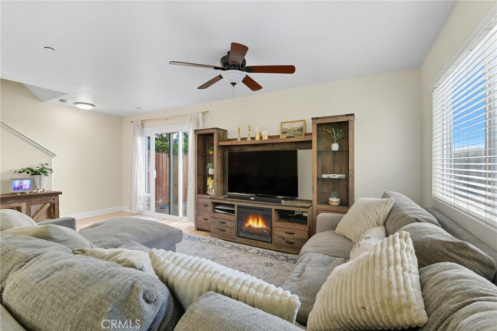 21711 Doss Place Saugus, CA 91350 - Photo 6 of 27 a living room with furniture and a flat screen tv