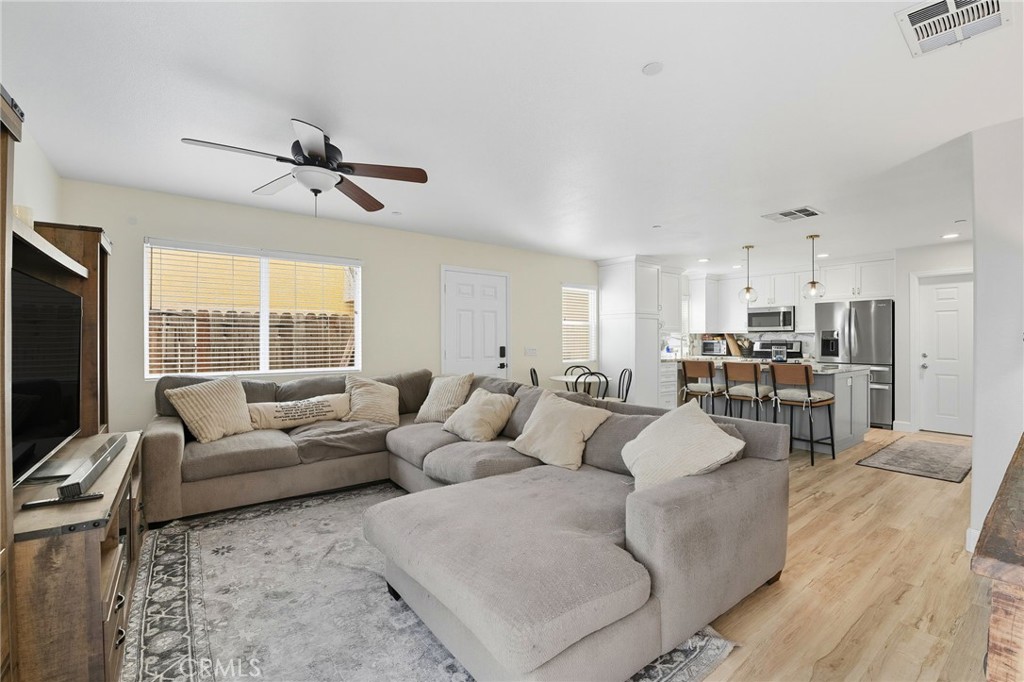 21711 Doss Place Saugus, CA 91350 - Photo 8 of 27 a living room with furniture kitchen view and a large window