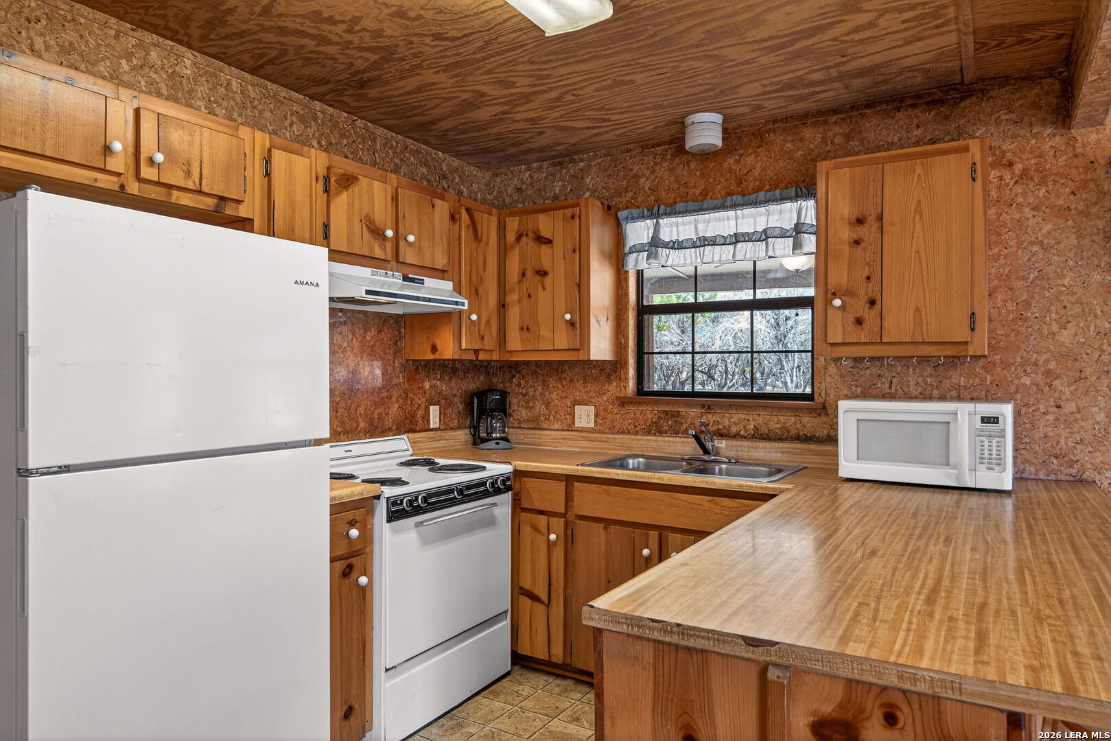 15 Cedar Lane Concan, TX 78838 - Photo 15 of 49 a kitchen with stainless steel appliances granite countertop a sink stove and refrigerator
