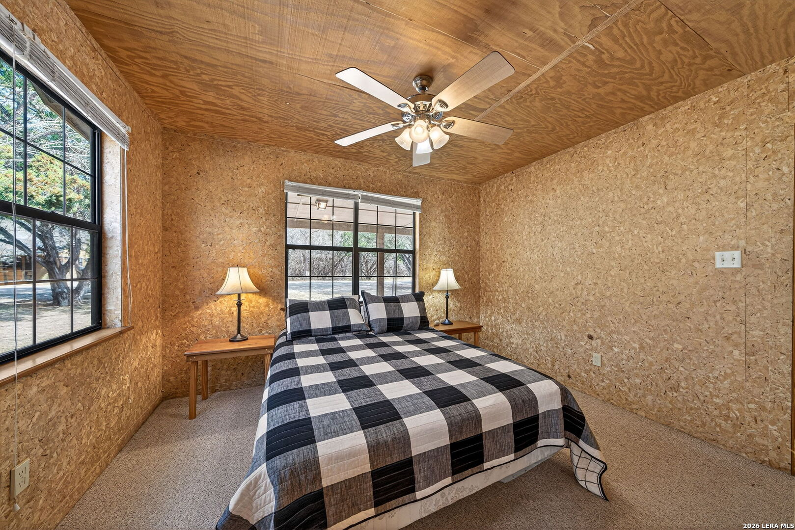15 Cedar Lane Concan, TX 78838 - Photo 19 of 49 a bedroom with a bed and a window