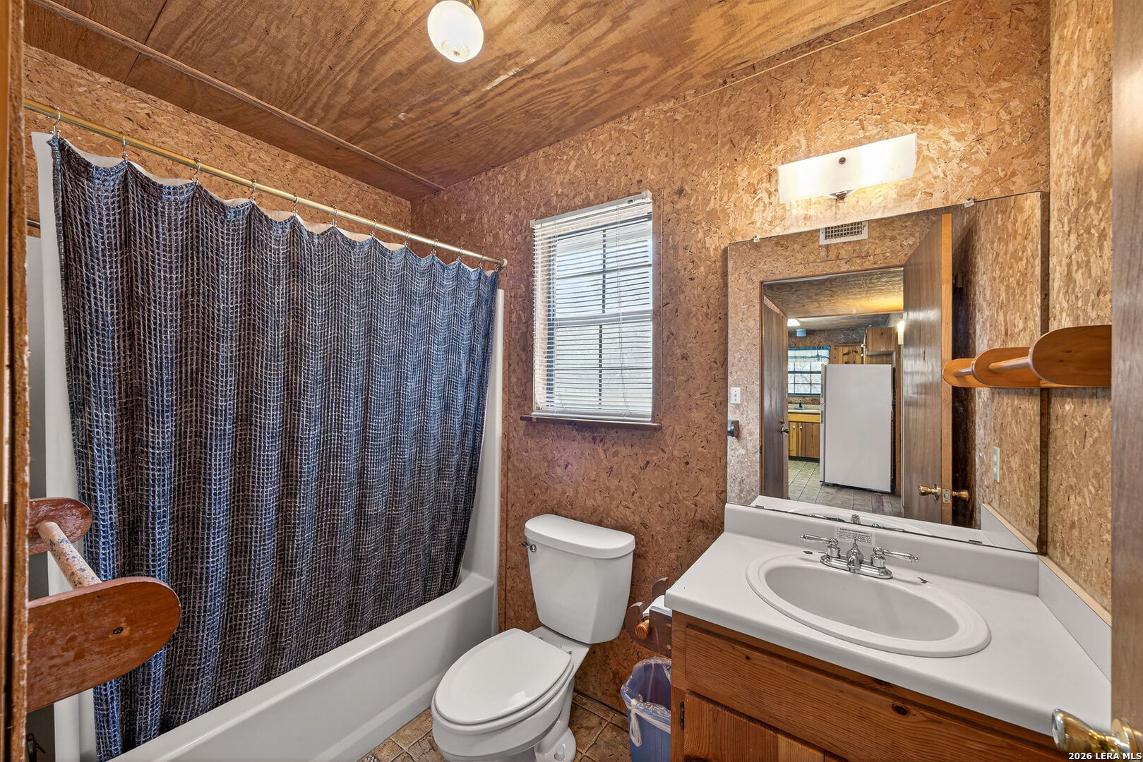 15 Cedar Lane Concan, TX 78838 - Photo 22 of 49 a bathroom with a granite countertop toilet sink and mirror