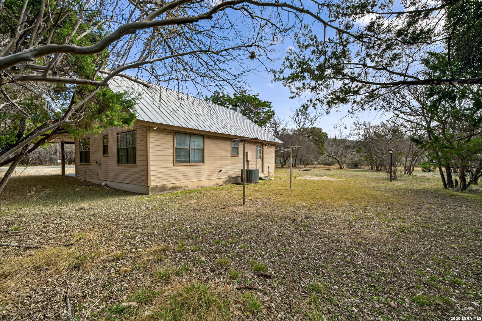 15 Cedar Lane Concan, TX 78838 - Photo 30 of 50 a house with lots of trees