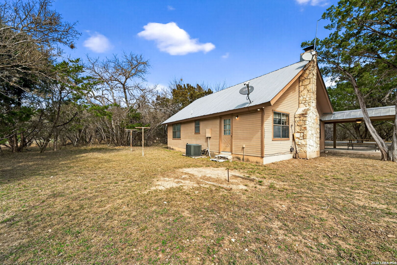 15 Cedar Lane Concan, TX 78838 - Photo 31 of 50 a view of a house with a yard