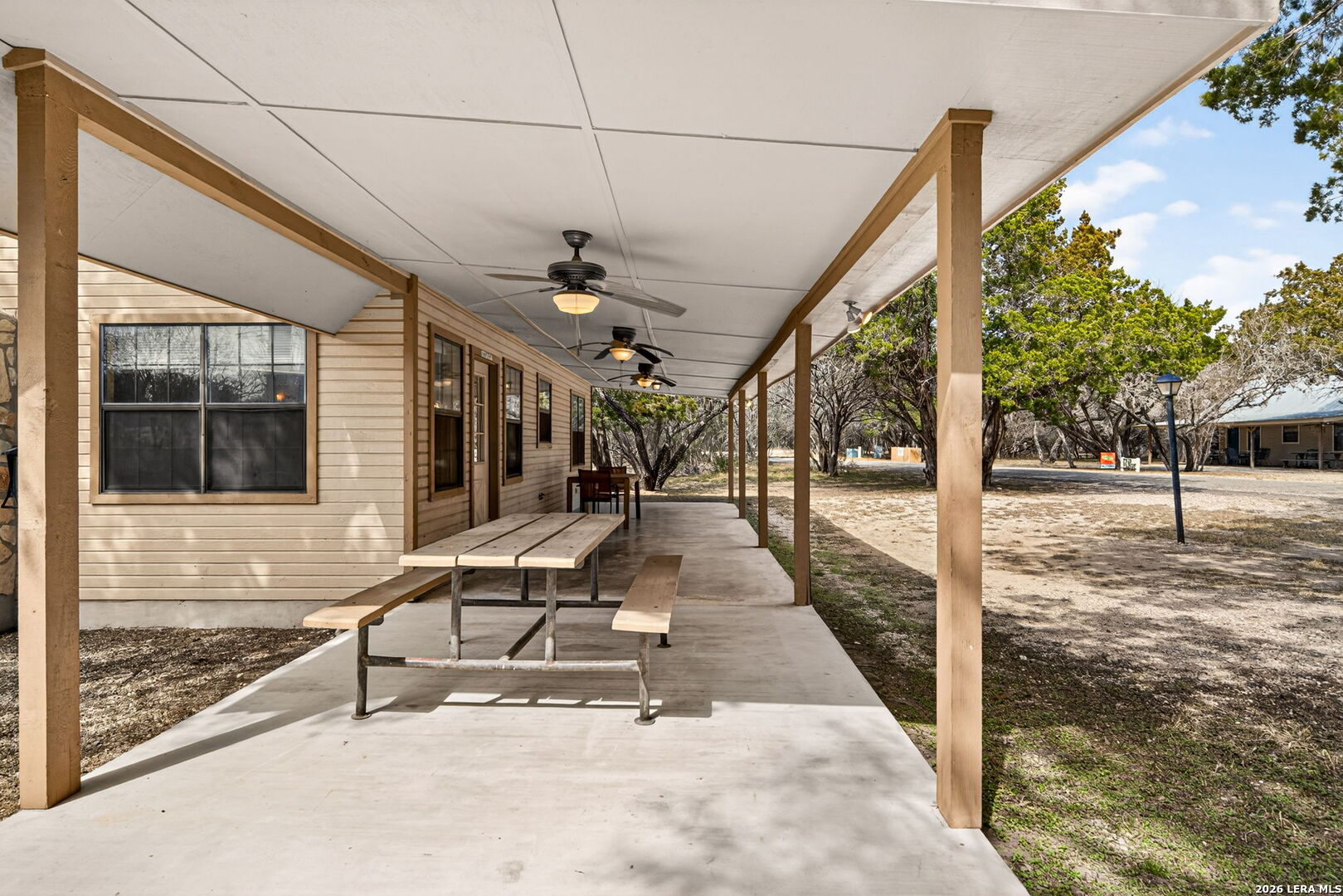 15 Cedar Lane Concan, TX 78838 - Photo 7 of 49 a view of a porch with a bench