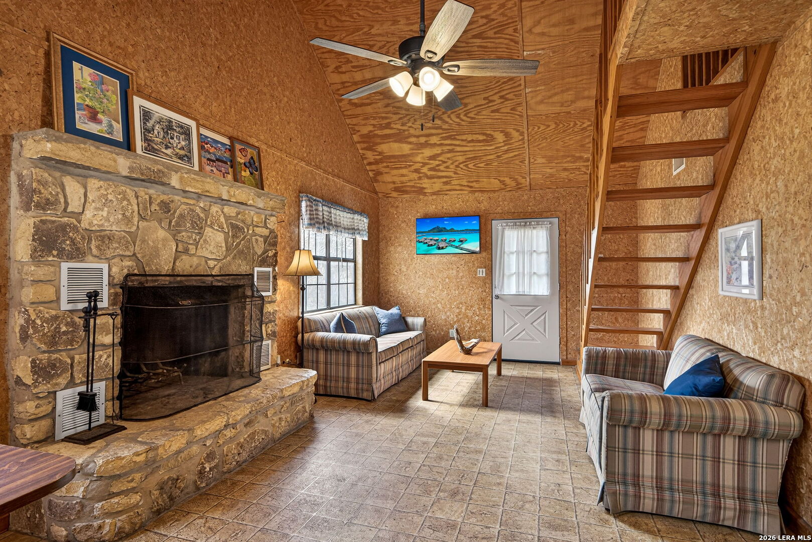 15 Cedar Lane Concan, TX 78838 - Photo 9 of 49 a living room with furniture and a fireplace