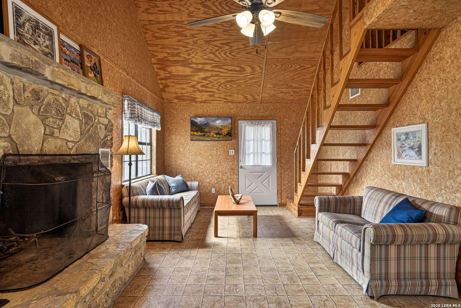 15 Cedar Lane Concan, TX 78838 - Photo 10 of 49 a living room with furniture and a fireplace