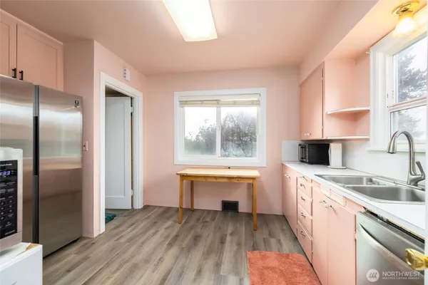 a kitchen with a sink stove and refrigerator