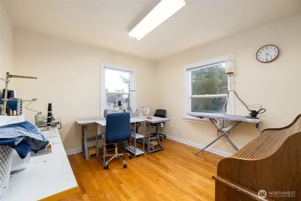 a work room with furniture and a window