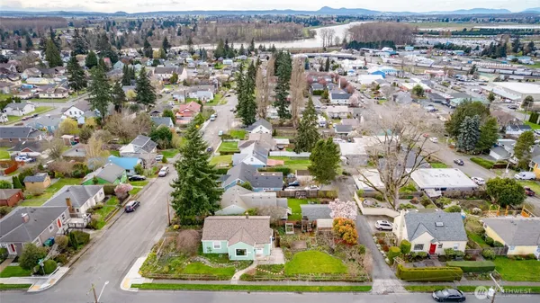 an aerial view of multiple houses with yard