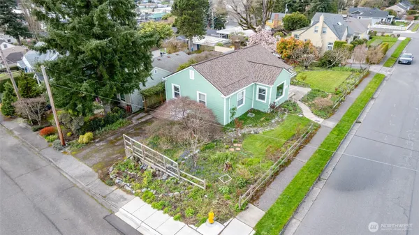 a aerial view of a house with a yard
