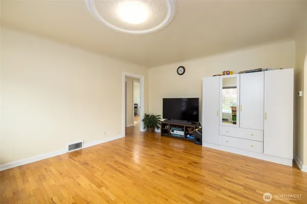 a view of a livingroom with furniture and a flat screen tv