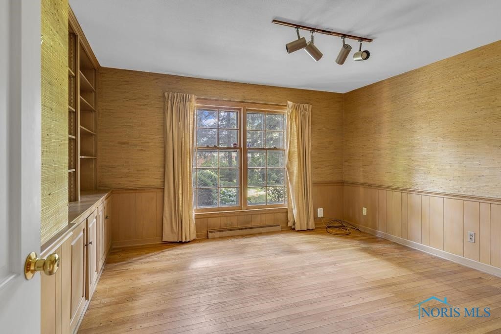 3432 Corey Road Toledo, OH 43615 - Photo 20 of 38 Den or office with built-ins and hardwood flooring