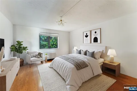 a bedroom with a large bed and a couch