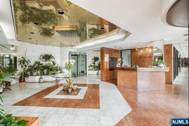 1150 River Road, Unit 4F Edgewater, NJ 07020 - Photo 17 of 22 a view of a living room and kitchen