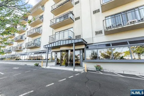 a view of a building with a window and sitting area