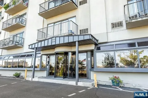 a view of a building with a window and sitting area