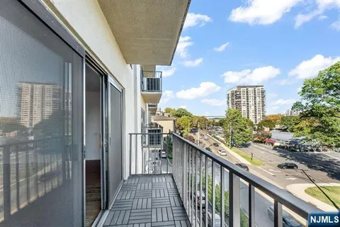 a view of a balcony with an outdoor space