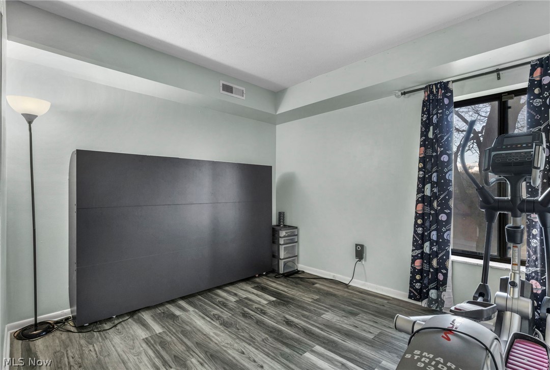 22952 Mastick Road, Unit 203 Cleveland, OH 44126 - Photo 22 of 35 Exercise room featuring dark hardwood / wood-style flooring