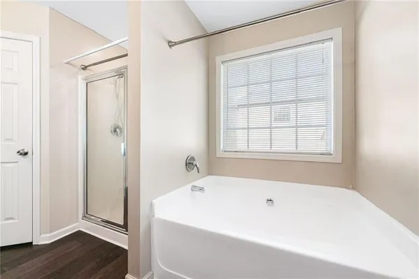 a white bath tub sitting next to a window