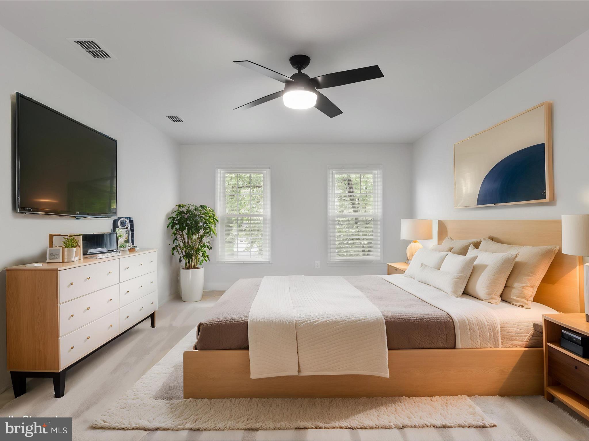 9365 River Crest Road Manassas, VA 20110 - Photo 28 of 62 a bedroom with a large bed and a flat screen tv