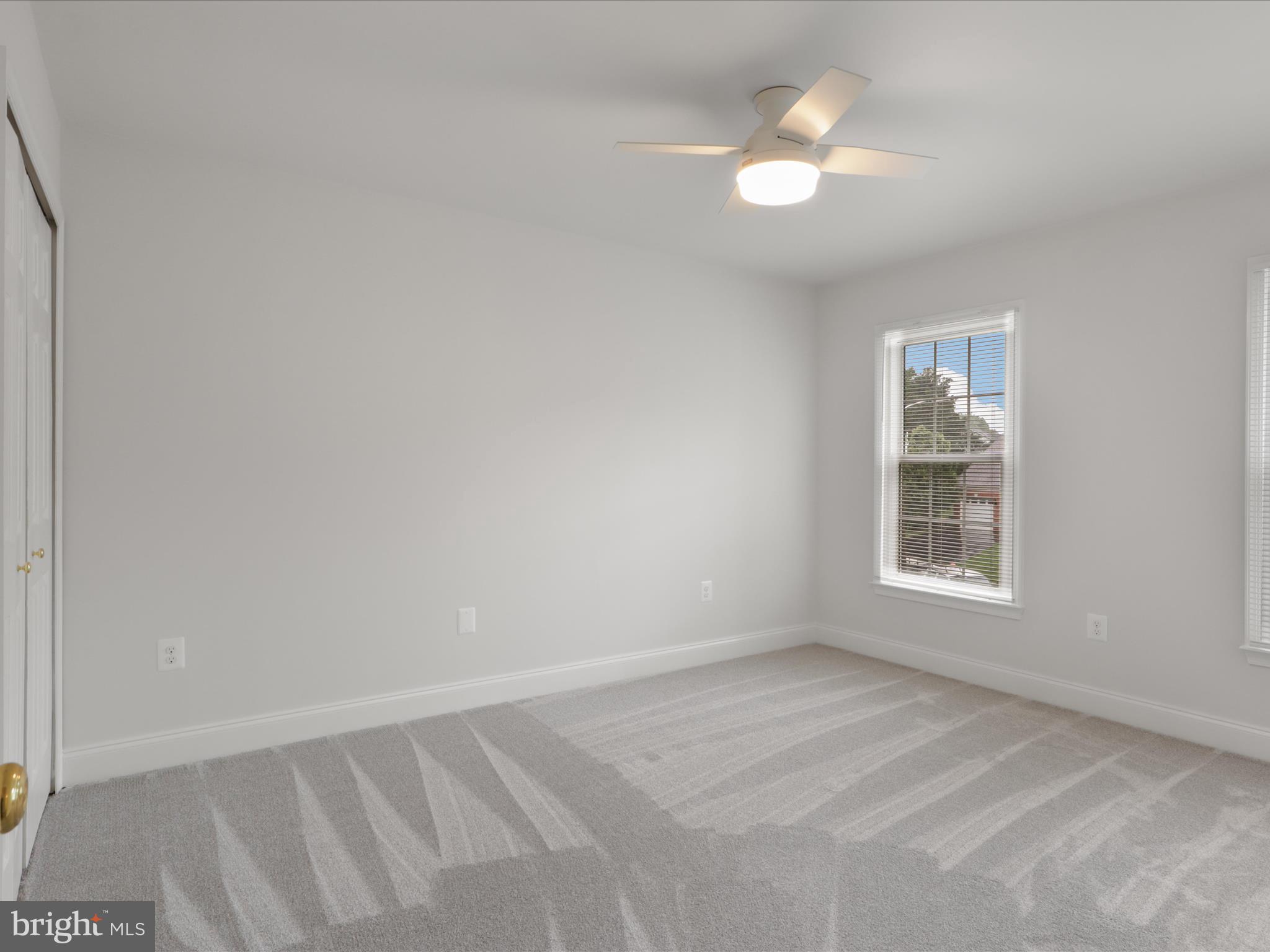 9365 River Crest Road Manassas, VA 20110 - Photo 39 of 62 an empty room with a window and a fan