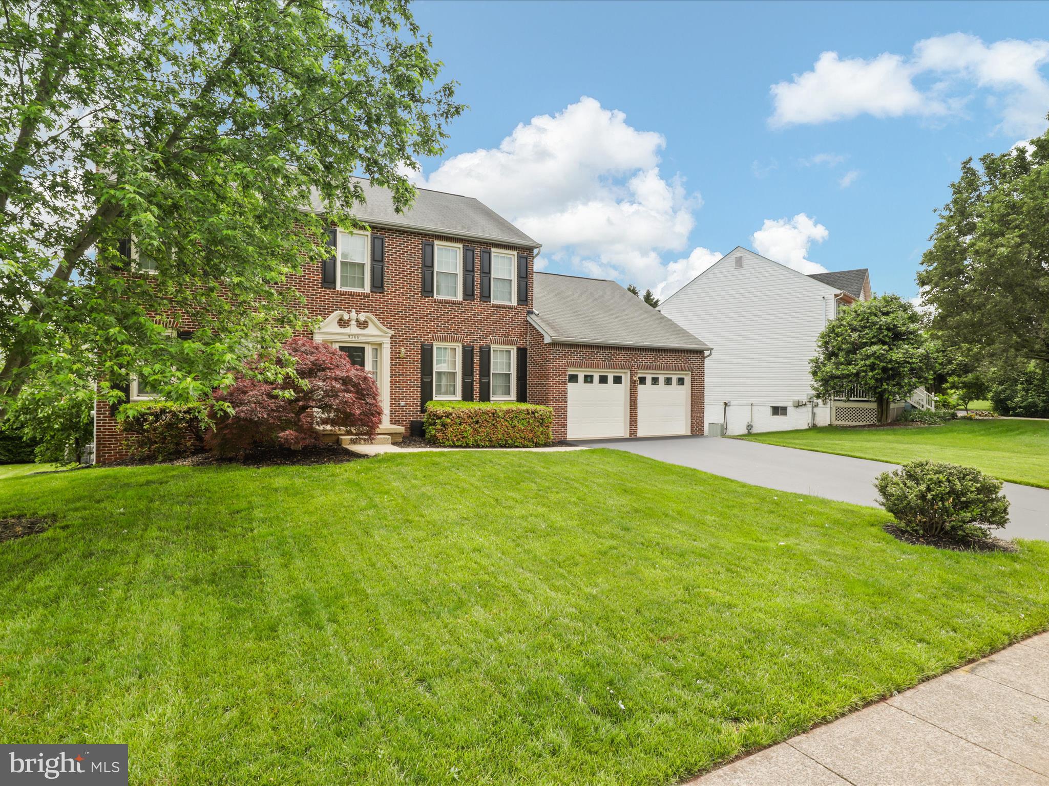 9365 River Crest Road Manassas, VA 20110 - Photo 4 of 62 a view of a house with a big yard plants and large trees