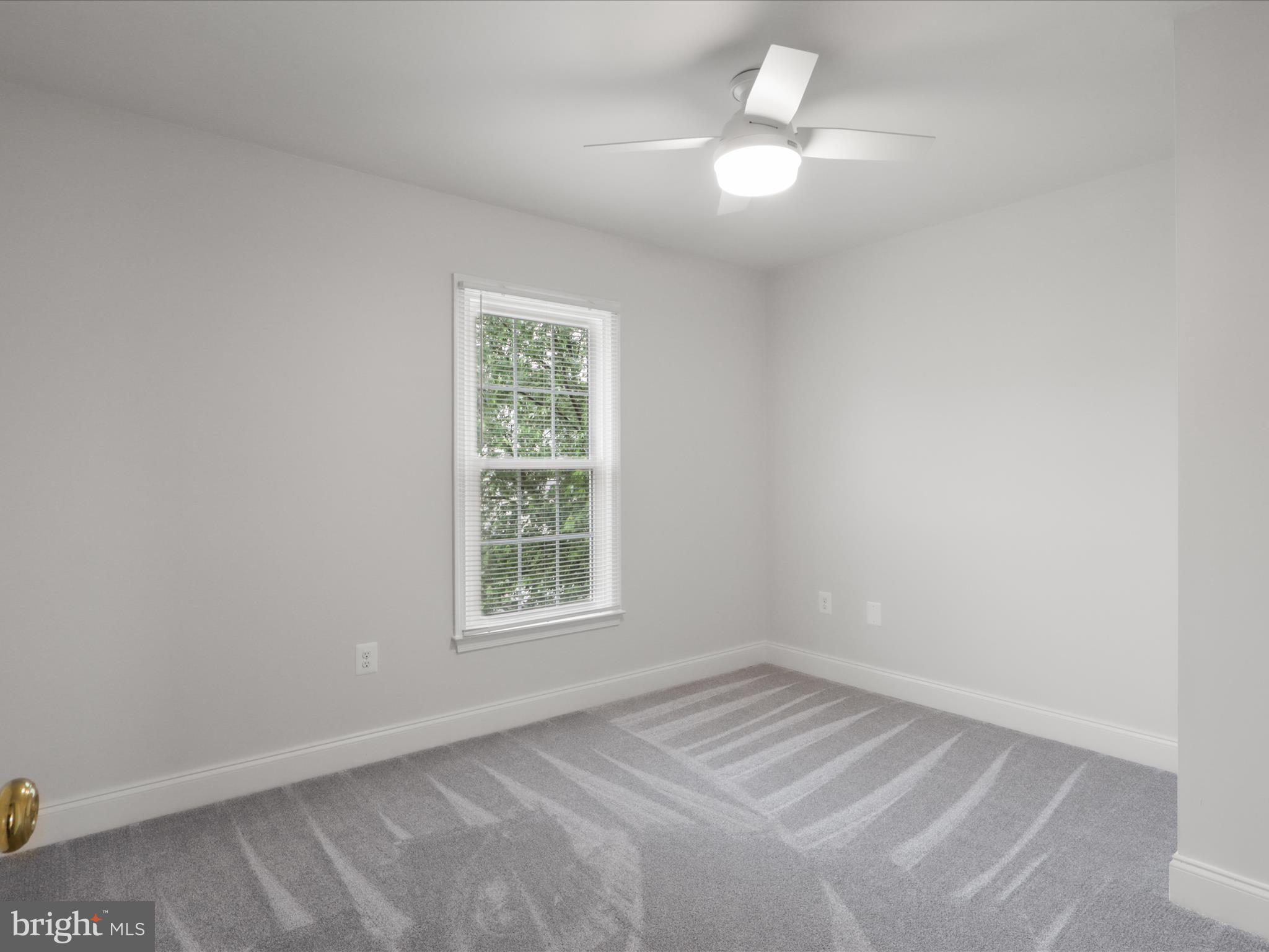 9365 River Crest Road Manassas, VA 20110 - Photo 41 of 62 an empty room with a window and a fan