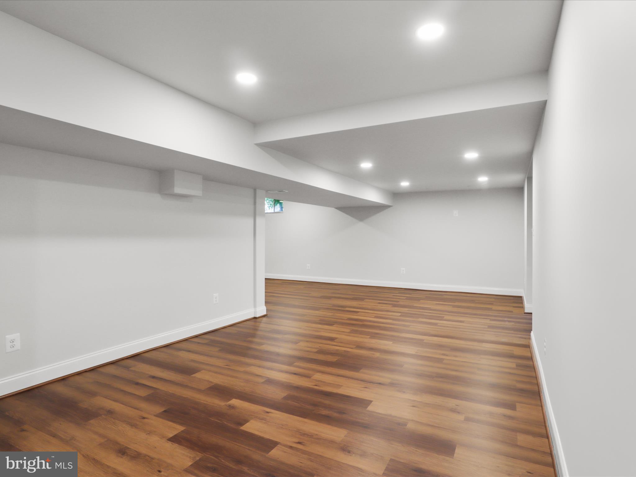 9365 River Crest Road Manassas, VA 20110 - Photo 47 of 62 an empty room with wooden floor and windows
