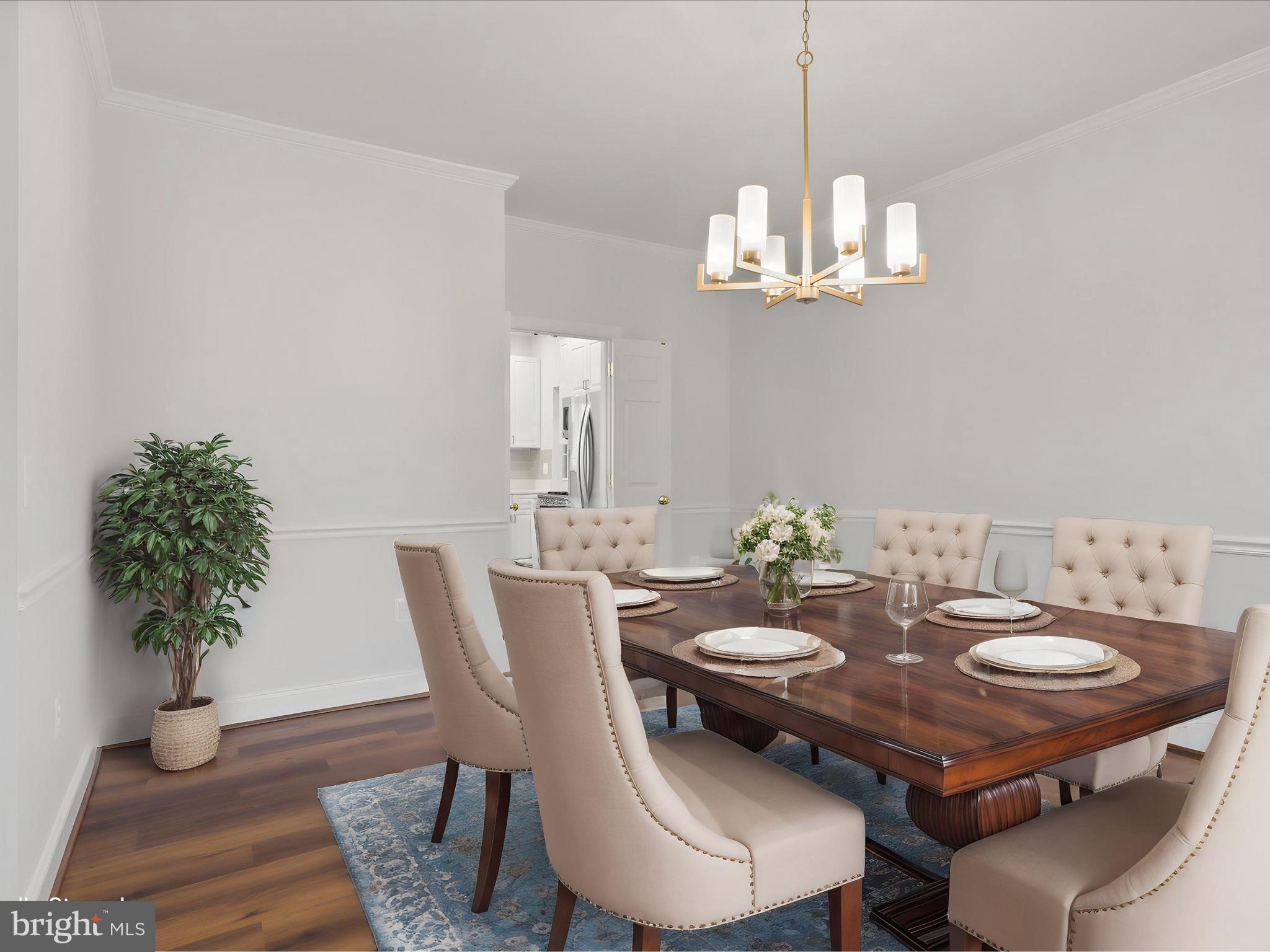 9365 River Crest Road Manassas, VA 20110 - Photo 9 of 62 a view of a dining room with furniture wooden floor and chandelier