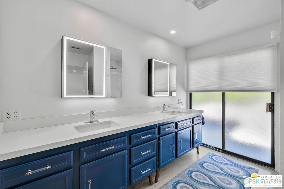 20 Kevin Lee Lane Rancho Mirage, CA 92270 - Photo 16 of 40 a bathroom with a double vanity sink and mirror