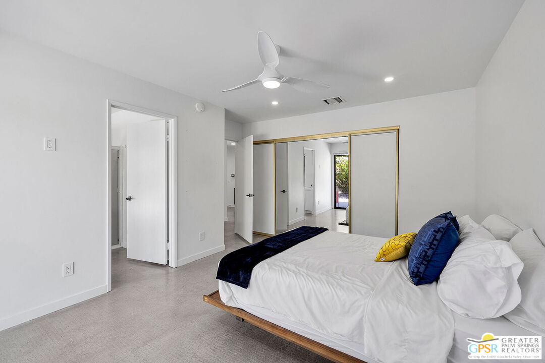 20 Kevin Lee Lane Rancho Mirage, CA 92270 - Photo 21 of 40 a bedroom with a bed and a refrigerator