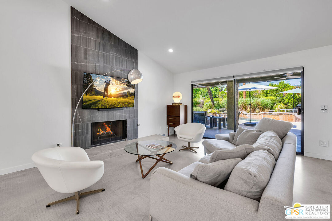 20 Kevin Lee Lane Rancho Mirage, CA 92270 - Photo 7 of 40 a living room with furniture and a fireplace