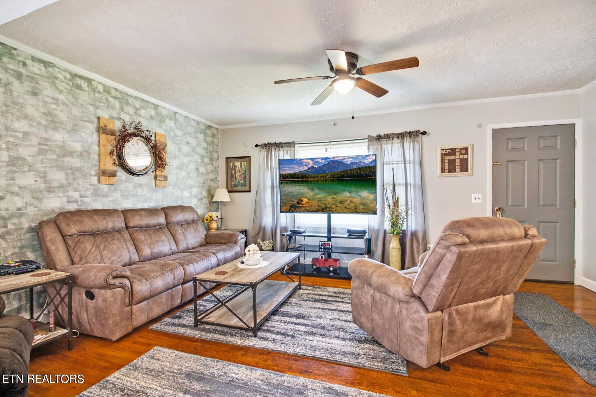 700 Rugby Avenue Jamestown, TN 38556 - Photo 11 of 24 a living room with furniture and a flat screen tv