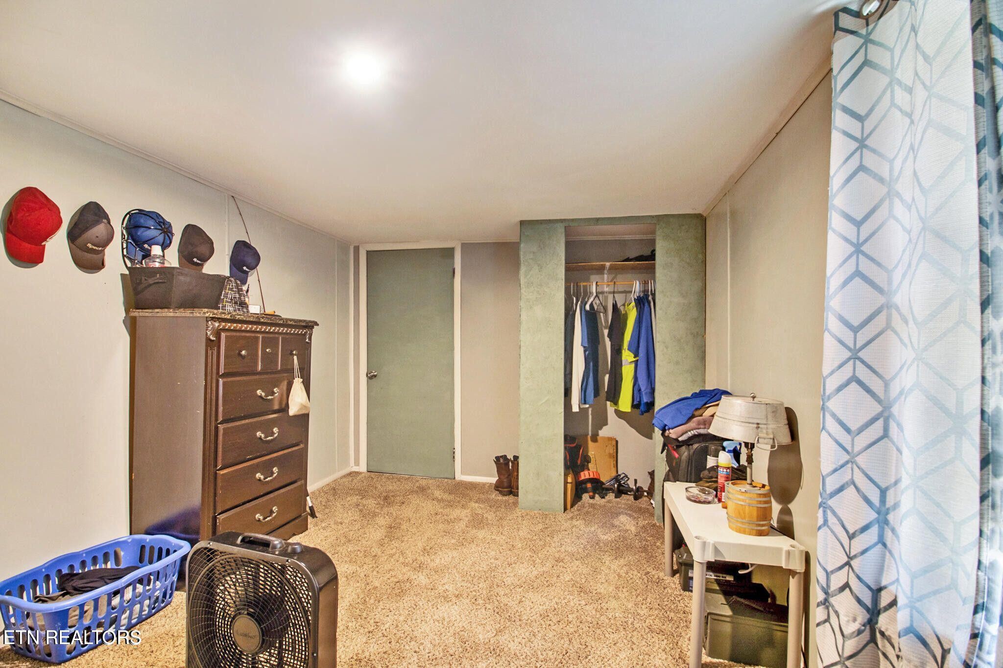 700 Rugby Avenue Jamestown, TN 38556 - Photo 15 of 24 a bedroom with a bed and furniture