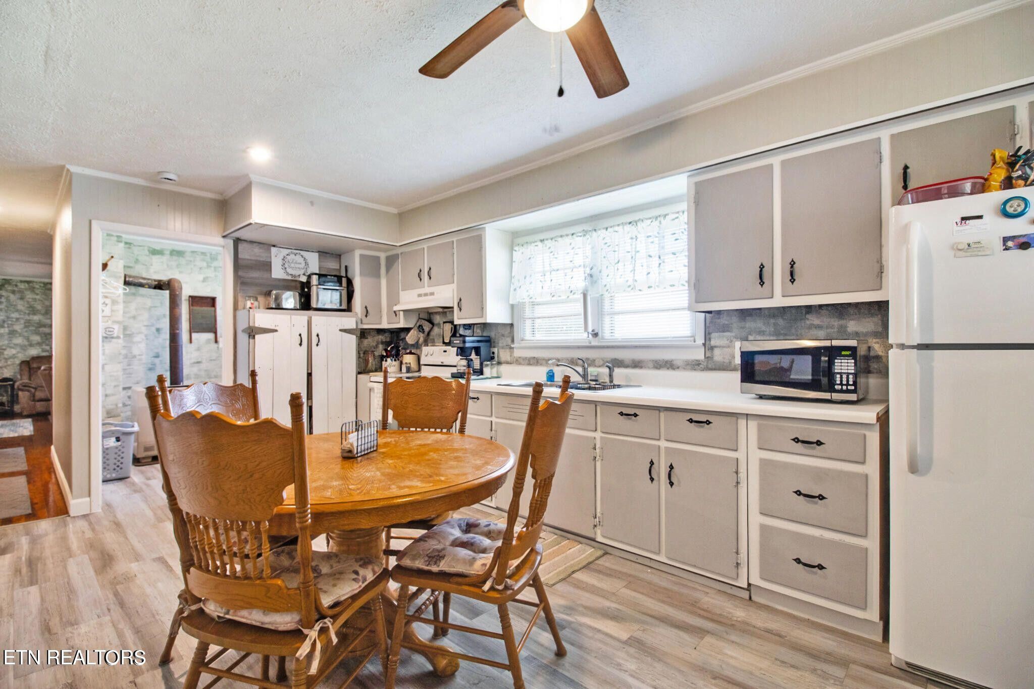 700 Rugby Avenue Jamestown, TN 38556 - Photo 17 of 24 a view of a dining room with furniture and a window