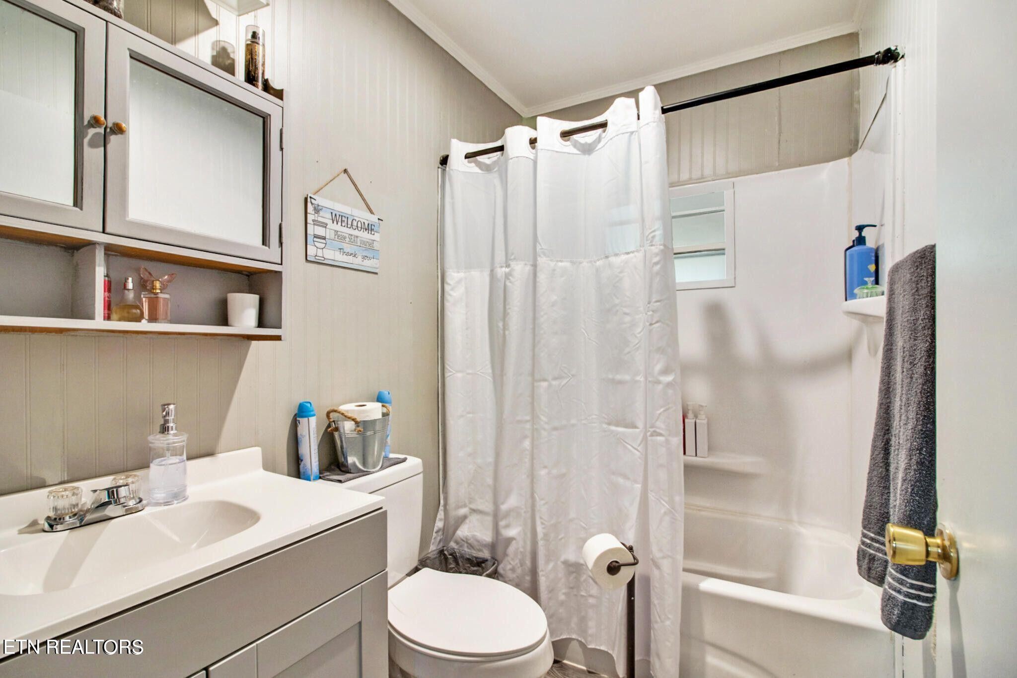 700 Rugby Avenue Jamestown, TN 38556 - Photo 20 of 24 a bathroom with a sink a toilet and shower