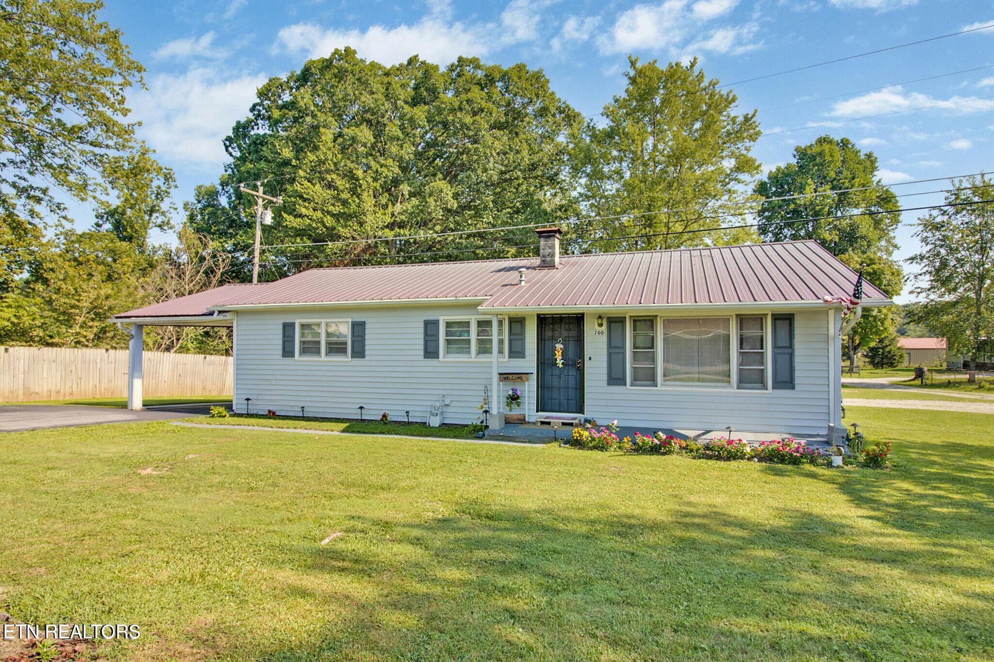 700 Rugby Avenue Jamestown, TN 38556 - Photo 2 of 24 a front view of a house with a yard