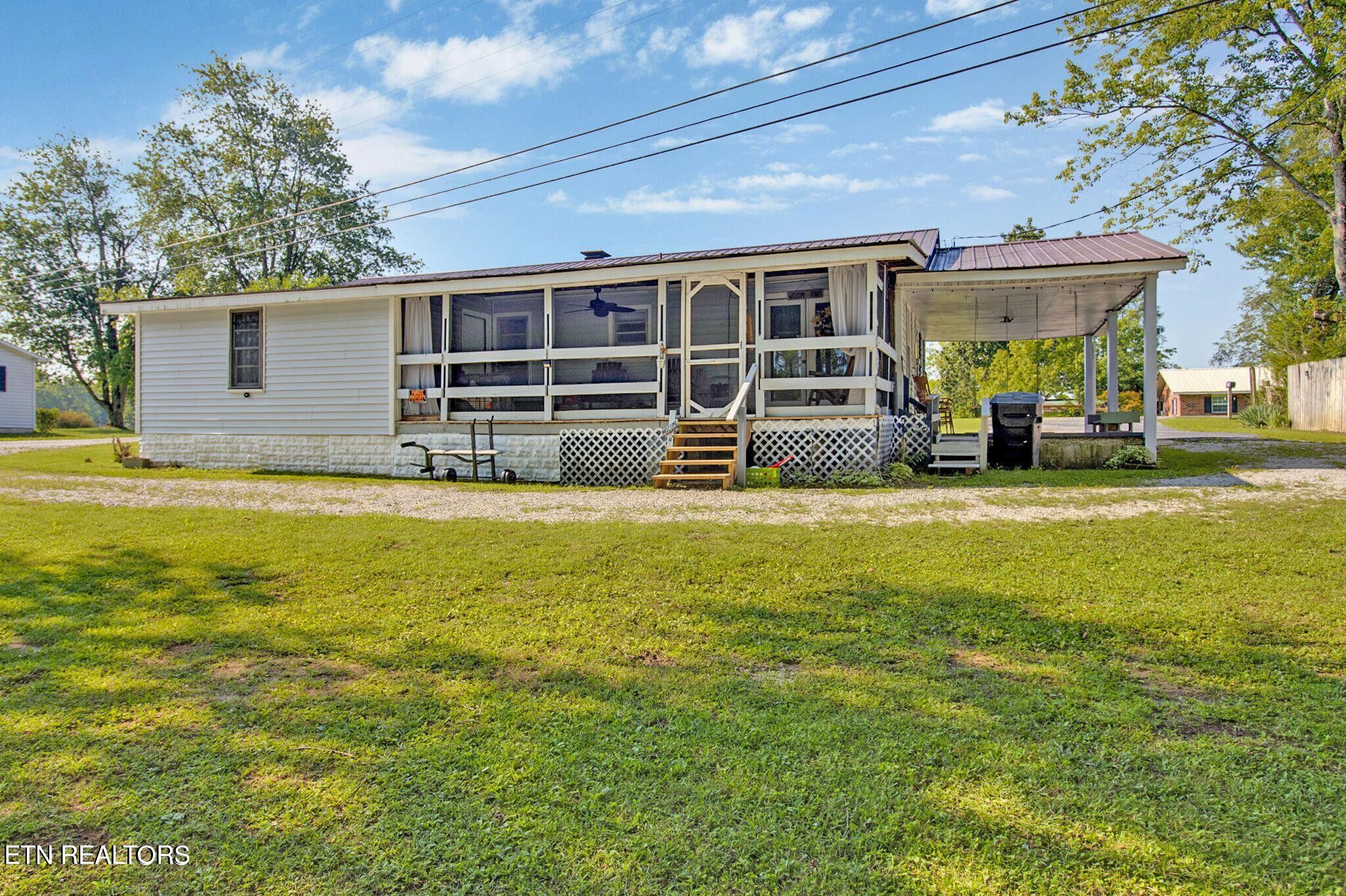 700 Rugby Avenue Jamestown, TN 38556 - Photo 6 of 24 a view of a house with a swimming pool