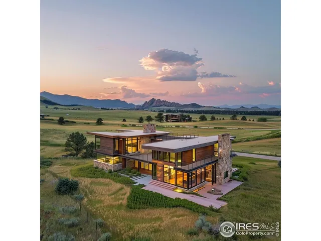 a view of a big room with furniture and a garden