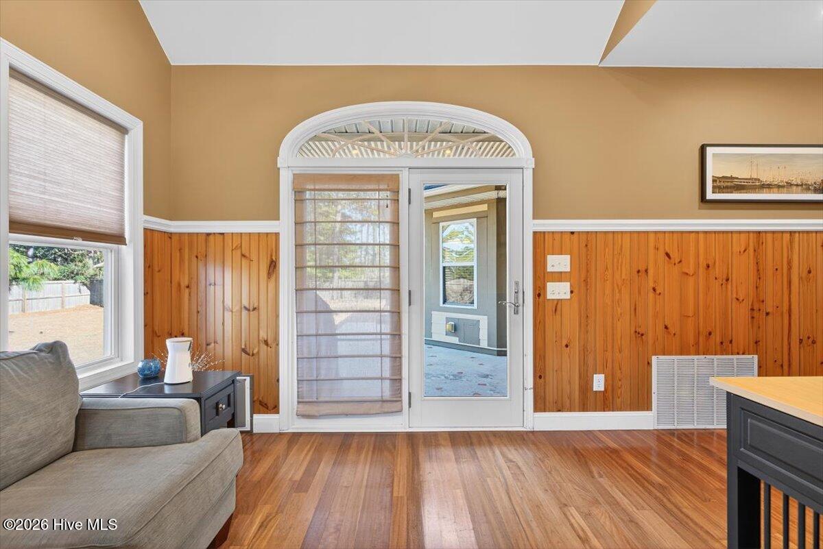 18 Brierwood Road Southwest Shallotte, NC 28470 - Photo 28 of 70 Spacious sunroom with arched entryways and panoramic windows, ideal for year-round enjoyment.