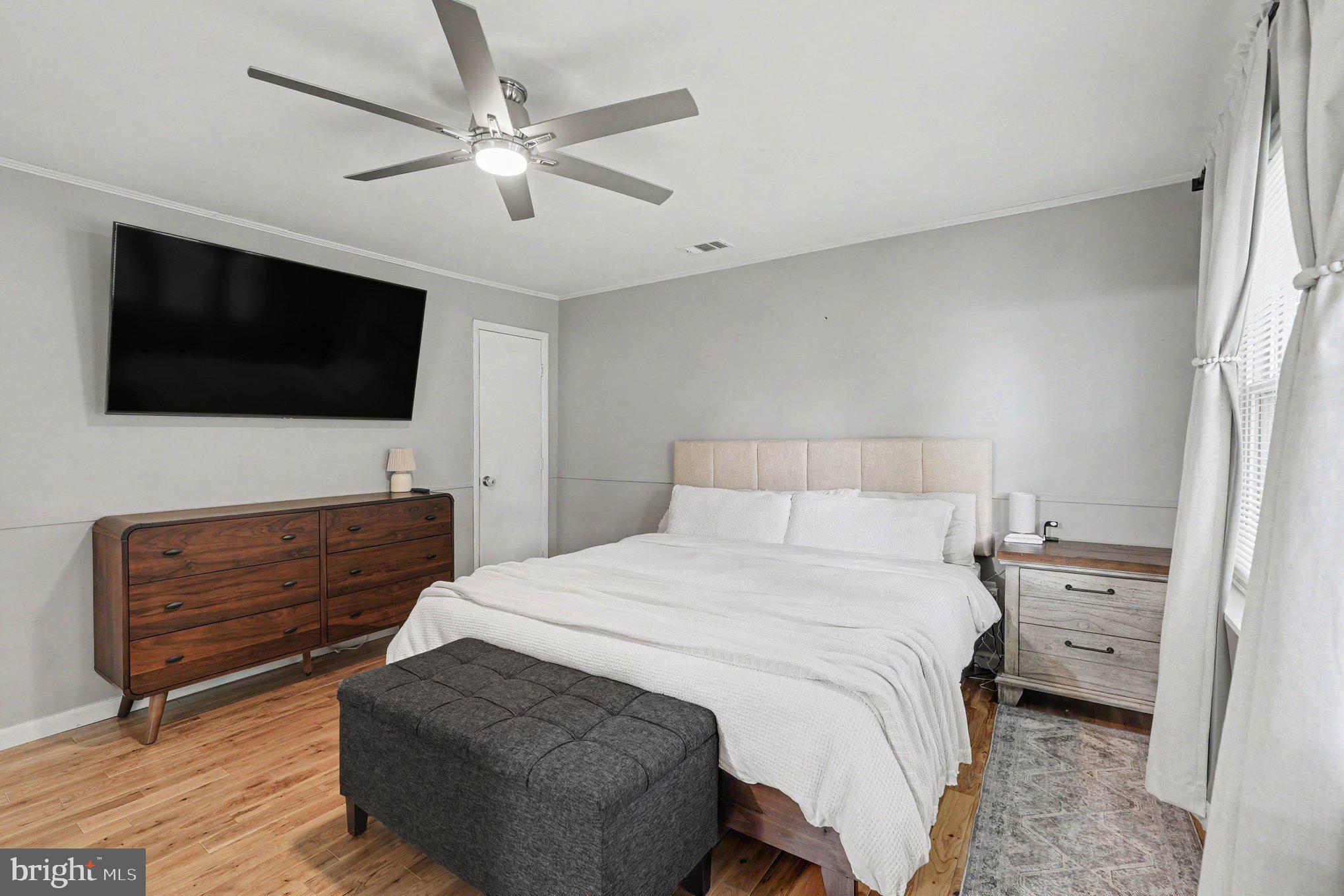 8853 Olde Mill Run Road Manassas, VA 20110 - Photo 11 of 29 Serene bedroom with modern touches.