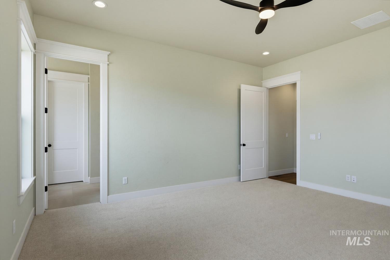 5054 Heritage Drive Marsing, ID 83639 - Photo 32 of 38 Carpeted room featuring a ceiling fan with integrated lighting, recessed lighting, and white trim throughout