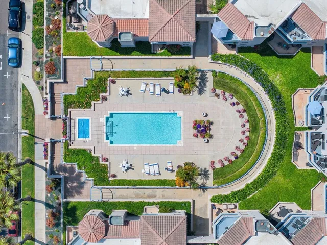 a view of swimming pool with a pathway