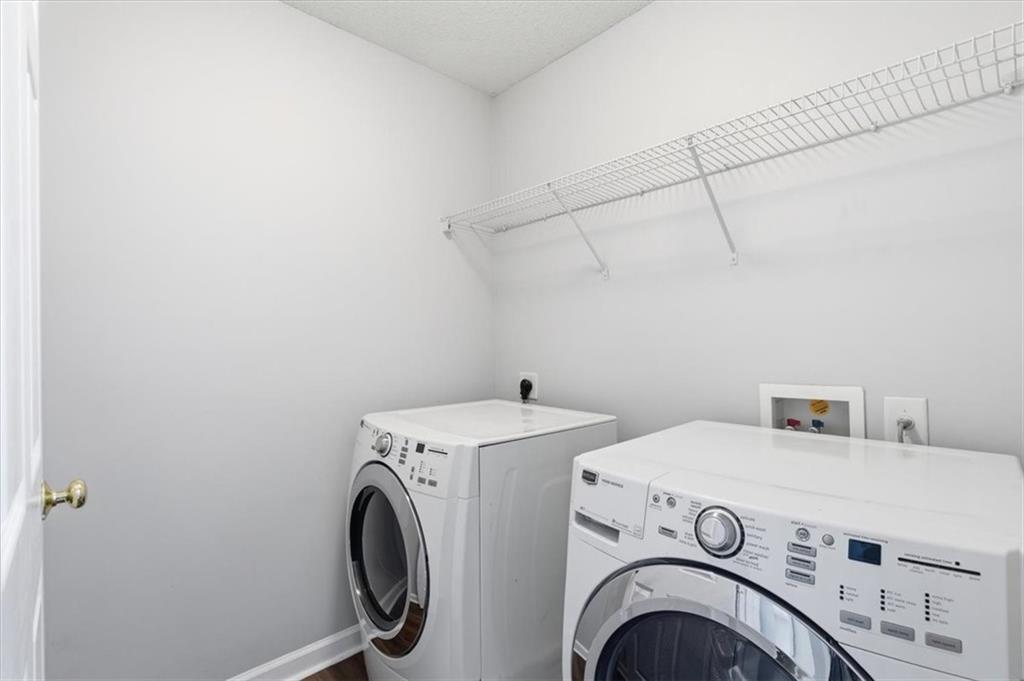 200 Riverstone Commons Circle Canton, GA 30114 - Photo 19 of 28 a utility room with dryer and washer
