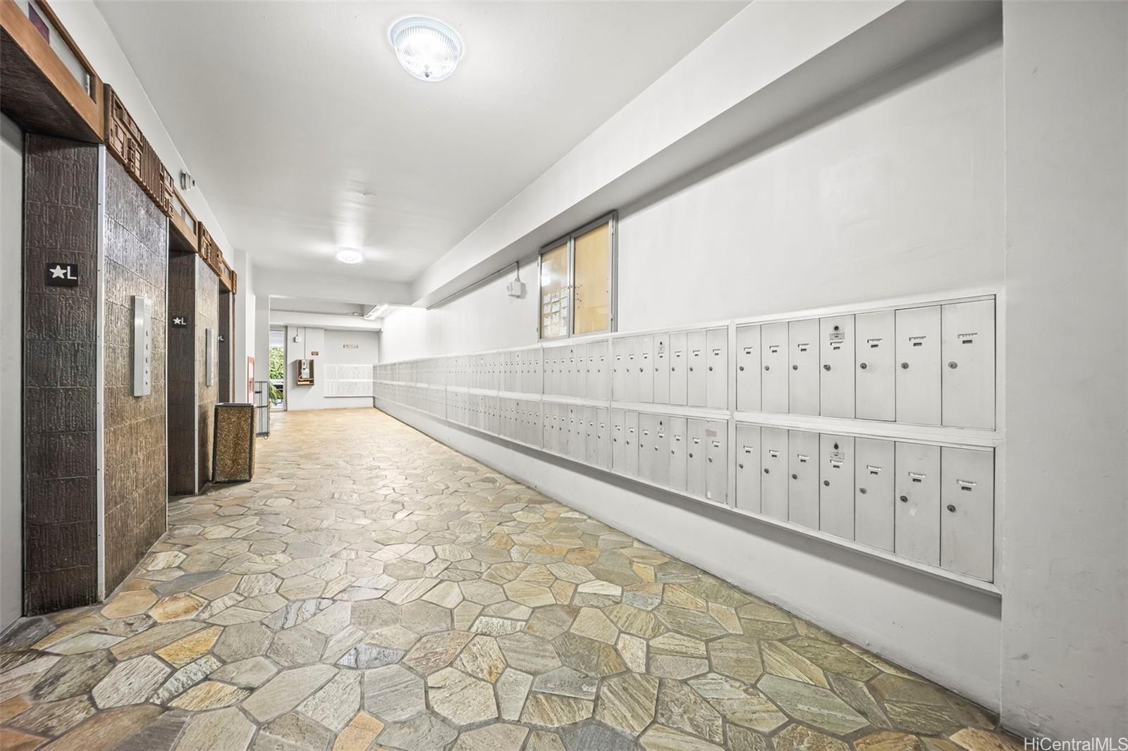 2888 Ala Ilima Street, Unit 2309 Honolulu, HI 96818 - Photo 12 of 18 Three elevators and mailbox bank.