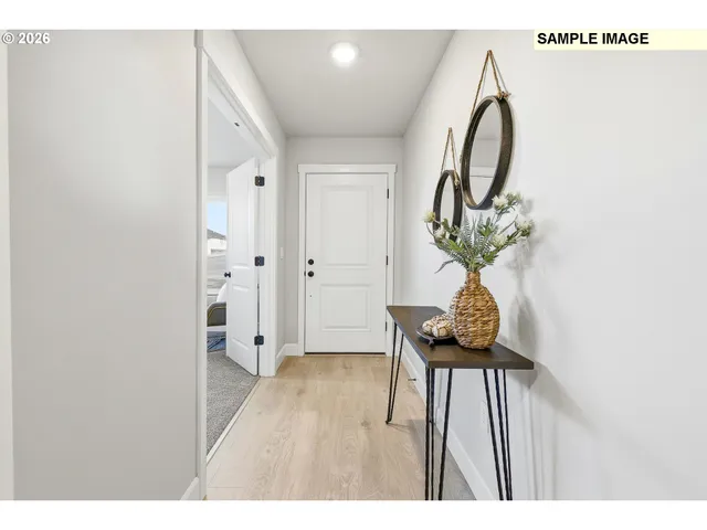 a view of a livingroom with furniture and wooden floor